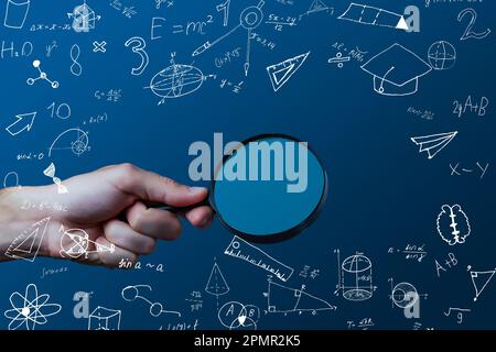 science, research and chemistry concept - young scientist in safety glasses with test tube and virtual projection of chemical formula. Stock Photo