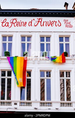 Gay Pride Flag hanging outside La Reine d'Anvers, restaurant. Antwerp, Flemish Region, Belgium, Europe Stock Photo