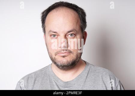 middle aged man with neutral but friendly expression Stock Photo