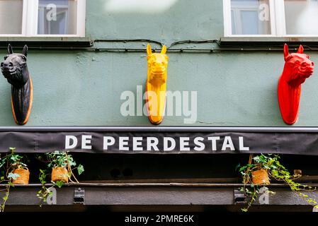 The heads of colored horses on the facade of the Restaurant De Peerdestal. Antwerp, Flemish Region, Belgium, Europe Stock Photo
