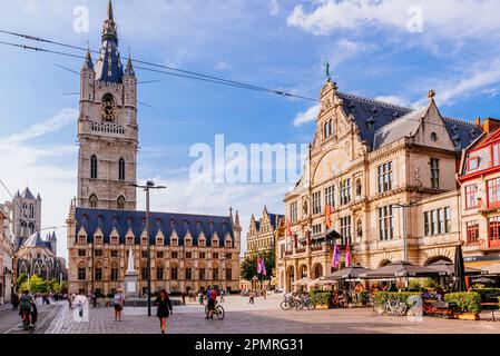 Sint-Baafsplein, the heart of the city. Three powers are represented in this central square: the citizenry by its mighty Belfry (C), the intellect by Stock Photo