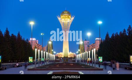 Astana (Nur-Sultan), Kazakhstan - April 4, 2023: Nurjol Boulevard with Baiterek tower at dusk in Astana city Stock Photo