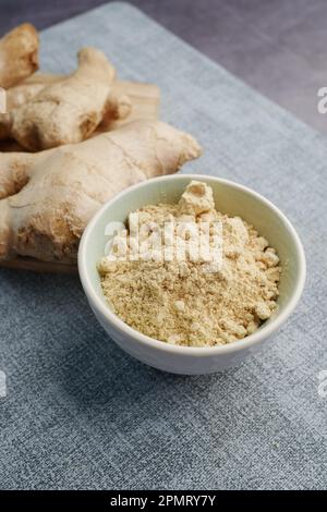 Ginger powder in a container on table  Stock Photo