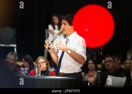 Vancouver, British Columbia, Canada. 14th Apr, 2023. Prime Minister JUSTIN TRUDEAU holds a town hall Q&A with members of the Squamish First Nation, April 14, on reserve land near North Vancouver, British Columbia. Trudeau used the occasion to announce $8.2 billion in funding over 10 years to the First Nations Health Authority in the province, which took over responsibility from the federal government for the management and delivery of healthcare for B.C.'s 200 indigenous communities in 2013. With Friday's renewal of funding, the government acknowledged Indigenous Canadians have faced histo Stock Photo
