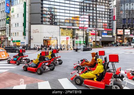 April 2023 Tourists enjoy driving Mario Go-Karts carts on the streets of Tokyo driving through Shibuya ward,Tokyo,Japan,Asia Stock Photo