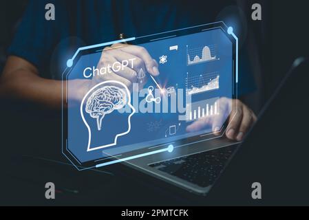 businessman using laptop computer chatting with a smart AI or artificial intelligence. Digital technology robot information concept. Stock Photo