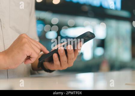 male hands using smartphone with copy space, searching or social networks concept, digital technology online, internet connection. Stock Photo
