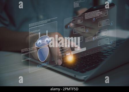 businessman using laptop computer chatting with a smart AI or artificial intelligence. Digital technology robot information concept. Stock Photo