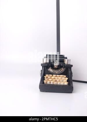 Black vintage typewritter on a white background. Stock Photo
