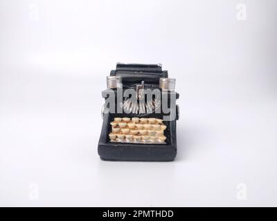 Black vintage typewritter on a white background. Stock Photo