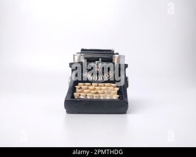 Black vintage typewritter on a white background. Stock Photo