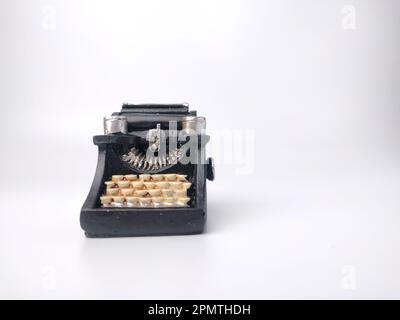 Black vintage typewritter on a white background. Stock Photo
