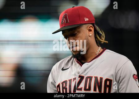 Arizona Diamondbacks' Ketel Marte walks back to the dugout after striking  out against the Los Angeles Dodgers during the first inning of a baseball  game Thursday, April 6, 2023, in Phoenix. (AP