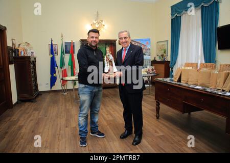 Pagani, Salerno, Italy. 14th Apr, 2023. Pagani, Salerno, Italy - April 14, 2023 : Seen the Senator, Maurizio Gasparri, to the Municipality of Pagani to attend the opening of the doors of the Sanctuary of the Madonna delle Galline, an ancient feast held on Sunday after Easter. To welcome him in Pagani on April 14, 2023, the Mayor of the city, Lawyer Raffaele Maria De Prisco. In memory of the feast was offered to the Vice President of the Senate, Maurizio Gasparri, a small statue depicting the image of the Madonna delle Galline, created by the pagan artist, Maestro Alfonso Pepe.In the photo Stock Photo