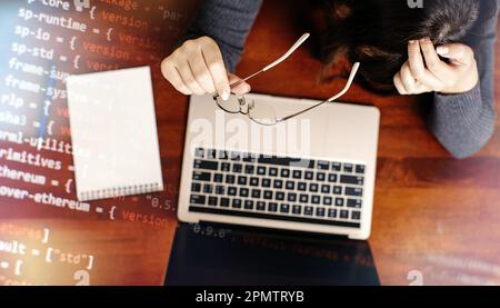 Programmer working on laptop computer and coding code on screen. Internet and technology Stock Photo