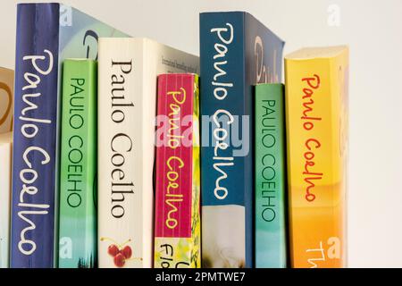 Nova Bana, Slovakia - April, 14, 2023 : A pile of books written by Brazilian author Paulo Coelho. Stock Photo