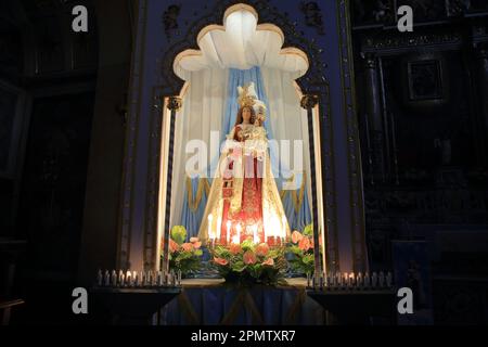 Pagani, Salerno, Italy - April 14, 2023 : Seen the Senator, Maurizio Gasparri, to the Municipality of Pagani to attend the opening of the doors of the Sanctuary of the Madonna delle Galline, an ancient feast held on Sunday after Easter. To welcome him in Pagani on April 14, 2023, the Mayor of the city, Lawyer Raffaele Maria De Prisco. In memory of the feast was offered to the Vice President of the Senate, Maurizio Gasparri, a small statue depicting the image of the Madonna delle Galline, created by the pagan artist, Maestro Alfonso Pepe.The statue of the Madonna delle Galline inside the Stock Photo