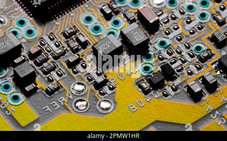 A close-up shot of an electronic circuit board with many electronic components Stock Photo