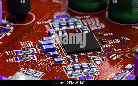 A close-up shot of an electronic circuit board with many electronic components Stock Photo