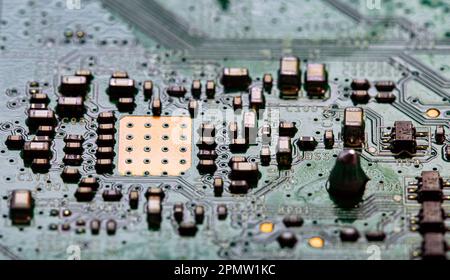 A close-up shot of an electronic circuit board with many electronic components Stock Photo