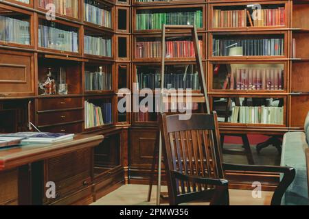 Study room with bookcases in brown style. Stock Photo