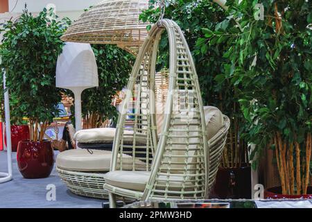White rattan round bed with canopy and pillows. Stock Photo