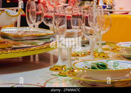 Wine glasses on a beautifully set table. Stock Photo