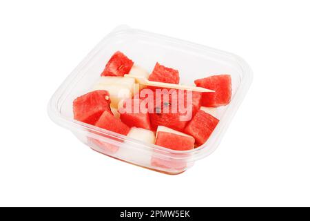 Fruit salad with watermelon and melon in a plastic container on a white background. High quality photo Stock Photo