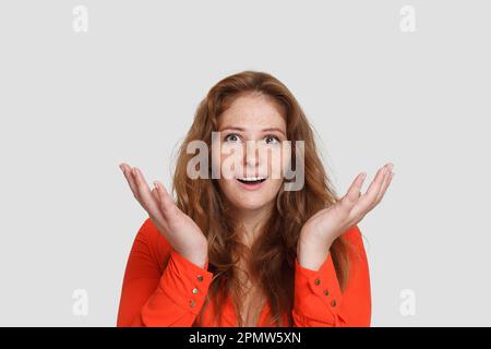Beautiful shocked surprised woman on white portrait Stock Photo