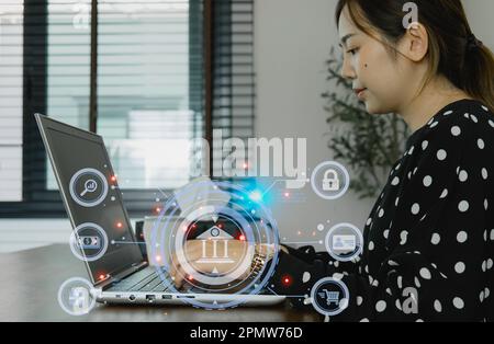 Businesswoman typing on laptop and hologram of hud with bot icon and social network with diverse people portraits. tech nology, artificial intelligenc Stock Photo