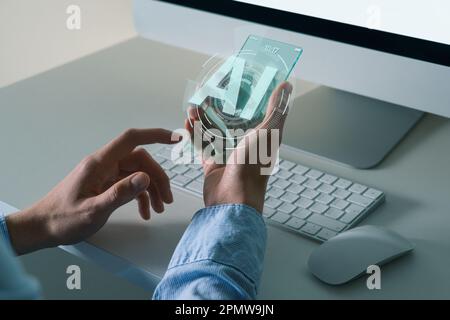 Man holding transparent futuristic smartphone with AI symbol. Artificial intelligence concept. High quality photo  Stock Photo