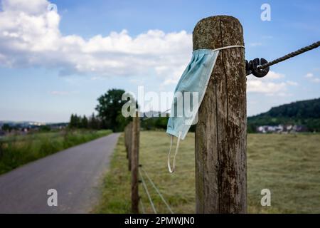 The new waste problem in Germany, mouth-nose protection. Waste during COVID-19. Stock Photo