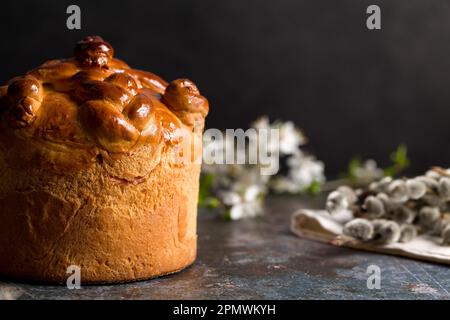 Homemade Easter cake with willow branches on a black background Stock Photo