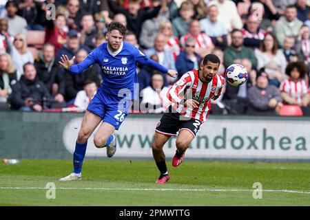 Sheffield, UK. 15th Apr, 2023. lliman Ndiaye of Sheffield Utd (R) is challenged by Jack Simpson of Cardiff City during the Sky Bet Championship match at Bramall Lane, Sheffield. Picture credit should read: Andrew Yates/Sportimage Credit: Sportimage/Alamy Live News Stock Photo