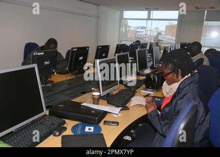 Businessmen and Business Woman Working on Computers in Computer Room at Business Conference England Stock Photo