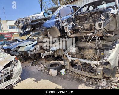 Scrapped cars and vehicles in the ruined city after earthquake, tsunami, volcanic eruption, landslide, terrorist incidents, military and civil Stock Photo