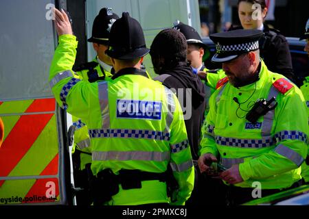 Aintree, Liverpool, UK. 15th Apr 2023. Animal Rising Protesters with placards carry out a peaceful protest outside the racecourse main entrance against the running of The Grand National and with plans to halt the running of the race. Credit: Mark Lear / Alamy Live News Stock Photo