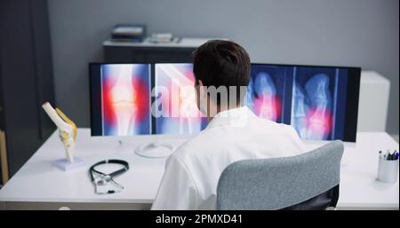 Dentist Using Computer Technology Dental Software For Teeth Xray Stock Photo