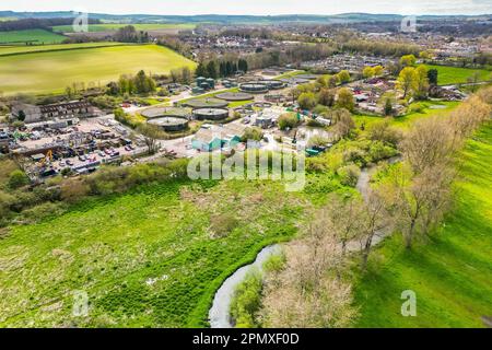 Dorchester, Dorset, UK.  15th April 2023.  View from the air of the Louds Mill sewage treatment works at Dorchester in Dorset owned by Wessex Water.   In 2022, the sewer storm overflow (Permit number: 401050) spilled 48 times for a total of 283.85 hours, discharging into the River Frome, which is a couple of hundred meters away from the sewage works.  (Source: https://theriverstrust.org/key-issues/sewage-in-rivers) Picture Credit: Graham Hunt/Alamy Live News Stock Photo