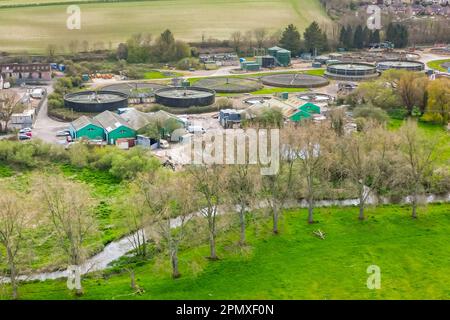 Dorchester, Dorset, UK.  15th April 2023.  View from the air of the Louds Mill sewage treatment works at Dorchester in Dorset owned by Wessex Water.   In 2022, the sewer storm overflow (Permit number: 401050) spilled 48 times for a total of 283.85 hours, discharging into the River Frome, which is a couple of hundred meters away from the sewage works.  (Source: https://theriverstrust.org/key-issues/sewage-in-rivers) Picture Credit: Graham Hunt/Alamy Live News Stock Photo