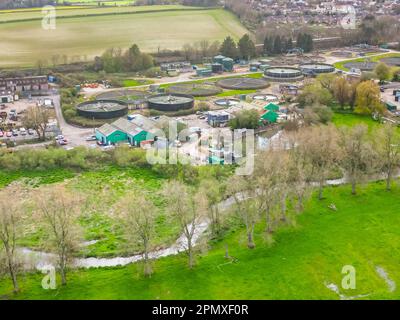 Dorchester, Dorset, UK.  15th April 2023.  View from the air of the Louds Mill sewage treatment works at Dorchester in Dorset owned by Wessex Water.   In 2022, the sewer storm overflow (Permit number: 401050) spilled 48 times for a total of 283.85 hours, discharging into the River Frome, which is a couple of hundred meters away from the sewage works.  (Source: https://theriverstrust.org/key-issues/sewage-in-rivers) Picture Credit: Graham Hunt/Alamy Live News Stock Photo