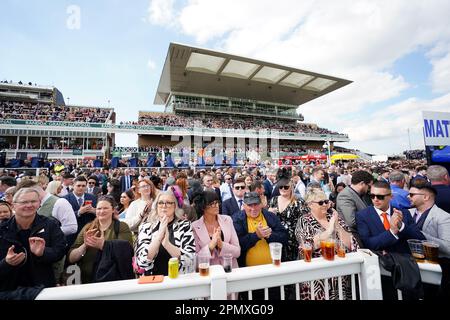 Racegoers take part in a minutes applause on the anniversary of the Hillsborough disaster on day three of the Randox Grand National Festival at Aintree Racecourse, Liverpool. Picture date: Saturday April 15, 2023. Stock Photo