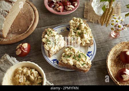 Three slices of sourdough bread with a spread made of leftover Easter eggs, mustard and cottage cheese Stock Photo