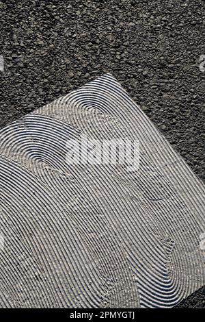 geometrical white painting of pedestrian crossing with texture on asphalt Stock Photo