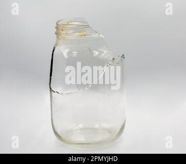 Studio shoot of broken glass jar closeup on white Stock Photo