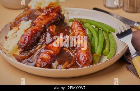 Sausages and mashed potatoes in a rich onion gravy. Stock Photo
