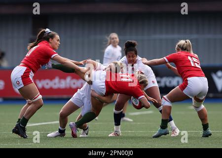 Cardiff, UK. 15th Apr, 2023. Lowri Norkett of Wales (11) is tackled. TikTok Women's Six Nations 2023 championship, Wales women v England women at Cardiff Arms Park in Cardiff, South Wales on Saturday 15th April 2023. pic by Andrew Orchard/Andrew Orchard sports photography/Alamy Live news Credit: Andrew Orchard sports photography/Alamy Live News Stock Photo