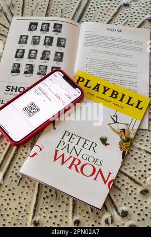 Playbills and Tickets on iPhone, Peter Pan Goes Wrong, 2023, NYC, USA Stock Photo