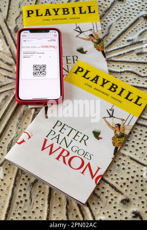 Playbills and Tickets on iPhone, Peter Pan Goes Wrong, 2023, NYC, USA Stock Photo