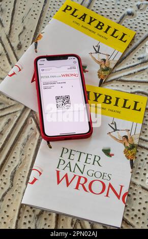 Playbills and Tickets on iPhone, Peter Pan Goes Wrong, 2023, NYC, USA Stock Photo